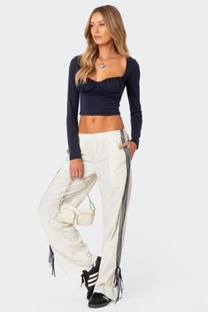 PRODUCT INFO Track pants Side stripe detailing Ribbon tie ankle detail Elastic waist Polyester Model wears size S Model height is 5'8 Item care: Wash with similar color Visionary Fashion, Casual Summer Tops, Swimwear Dress, Cropped Tube Top, Women Long Sleeve Tops, Casual Tops For Women, Asymmetrical Tops, Bottom Clothes, Bow Detail