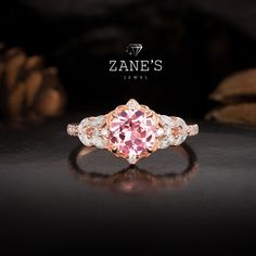 Experience the allure of our 14K Gold Pink Sapphire Ring, featuring a breathtaking 1.5ct round-cut Pink Sapphire as the centerpiece. Flanked by high-quality Moissanite stones, with additional Moissanite embellishments along the band, this ring sparkles with elegance and brilliance. The recommended gold setting complements the gemstone beautifully, enhancing its vibrant hue. This ring is an original design, meticulously handcrafted to ensure each piece is unique. Available in a variety of colors Pink Sapphire Round Cut Ring For Wedding, Pink Round Halo Ring With Accent Stones, Pink Sapphire Ring For Wedding, Pink Round Cut Sapphire Ring For Wedding, Pink Sapphire Wedding Ring Round Cut, Pink Halo Ring With Accent Stones, Pink Round Cut Sapphire Wedding Ring, Pink Gold Sapphire Ring With Diamond, Pink Round Halo Ring For Anniversary