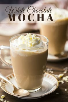 two glasses of white chocolate mocha with whipped cream on top