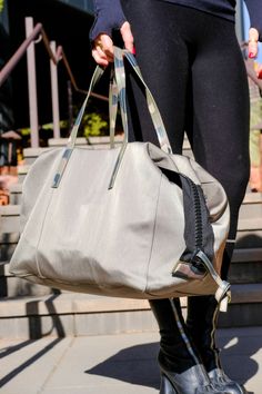 This convertible bag is the perfect lightweight solution for days and weekends when you need to carry it all but don’t want to be weighed down. Adjustable side flaps allow the bag to be pulled in for tote-style day wear or fully extended for weekender duffle-style functionality. IN TRANSIT can be comfortably carried by either the top handle or a strap can be added for hands-free wear. Dimensions: 15” wide (extended to 18”), 12 1.2” long, 9” deep Made in ItalyElevated Nylon with Luxury Leather TrimFully Washable Lining & 2 Leather PocketsLightweightUtilitarian Zipper HM IN TRANSIT Jogger Shorts Women, Shinola Watch, Convertible Bags, Blazer Shirt, Jogger Shorts, Hats For Sale, Jewelry Bags, Convertible, Camo