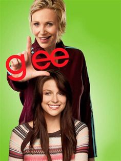 two women standing next to each other with the words glee on their forehead and one pointing up