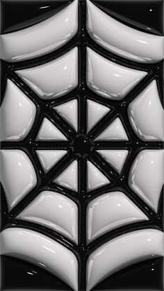 a black and white spider web tile pattern