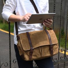 The Waterproof Waxed Canvas 14 Laptop Messenger Bag from Woosir is a stylish and functional bag designed for everyday use. The bag is made from a waterproof waxed canvas material and features a padded laptop compartment, two internal slip pockets, and two external pockets. It also comes with adjustable shoulder straps and a comfortable carrying handle. The bag is ideal for carrying laptops, books, documents, and other items.   ITEM DETAILS     Lining Material: Polyester  Handbags Type: Shoulder Bags  Interior: Computer Interlayer,Interior Zipper Pocket,Cell Phone Pocket  Gender: Men  Style: Vintage  Main Material: Canvas  Closure Type: Zipper & Hasp  Size: Length: 38 cm, width: 12 cm, High:28 cm/  Length: 15" , width: 4.72", High:11"  Color: Light Khaki, Khaki, Dark Gray, Black, Army Green Men’s Satchel, Brown Lifestyle, Brown Messenger Bag, Leather Messenger Bag Laptop, Small School Bags, Field Bag