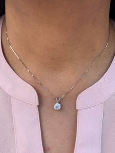 "14k Solid white gold Hand Set 1.00 Ct GRA Certified Pendant/Charm with Wheat Chain With or without chain  Choice of chain length: 16\", 18\" & 20\" This pendant is made with solid 14k white gold 4 prong hand set with hand pick 1.00 ct (6.5mm) Moissanite. The Stone is set in a 14K solid white gold double wire cup setting. The loop is very solid and has an opening to accommodate up to 4mm chain. The loop is marked 14k for metal authenticity. This stone comes with  GRA Certificate stating the GRAD Sterling Silver Solitaire Necklace With Prong Setting For Everyday, Everyday Sterling Silver Solitaire Necklace With Prong Setting, Silver Prong Set Diamond Necklace For Everyday, Sterling Silver Solitaire Necklace For Everyday, Everyday Silver Diamond Necklace With Vvs Clarity, Everyday Sterling Silver Diamond Necklace Vvs Clarity, Everyday Round Necklace With Prong Setting, Everyday White Gold Round Solitaire Necklace, Everyday White Gold Solitaire Necklace With Round Cut