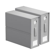 two gray boxes with white handles on each side