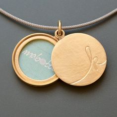 K - like Keith, Kathrina or Kylie! A beautiful gift for your loved ones: a locket for a one picture, or maybe a drawing or a passage of your favorite song, decorated with a delicate initial of your choice! Locket for one picture - diameter 22mm (0,86") - thickness: ca. 3,5mm (0,13") - design: initial - 18ct yellow gold How it works: * The lockets consist of two movable parts, fitting tightly together. * You have to push the lid to the side to open the locket. * The pictures are held by frames th Personalized Yellow Gold Medallion Locket Necklace, Yellow Gold Medallion Locket Necklace For Personalized Gift, Personalized Yellow Gold Locket Necklace With Initial Pendant, Yellow Gold Locket Necklace For Personalized Gift, Yellow Gold Locket Necklace Pendant For Personalized Gift, Yellow Gold Pendant Locket Necklace For Personalized Gift, Personalized Yellow Gold Locket Necklace For Anniversary, Gold Medallion Locket Necklace With Initials, Gold Jewelry With Initials For Keepsake