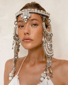 Rushi Modular Headpiece System in Pearl Choose pearl medallions or white thread tassels. The Rushi Headpiece is one of our most beloved designs. On each side, four removable components allow you to change the look and styling of this piece endlessly. Named after Liu Rushi (1618–1664) was a poet, an independent spirit (she often cross-dressed), known as one of the "Eight Beauties of Qinhuai" and a patriot. Sold by her family into prostitution at an early age, Liu Rushi had a hard life, but with h Filipino Headpiece, Pearl Headdress, Headgear Fashion, Black Is King, Ethiopian Wedding, Thread Tassels, Beaded Headpiece, Chain Headpiece, Festival Headpiece