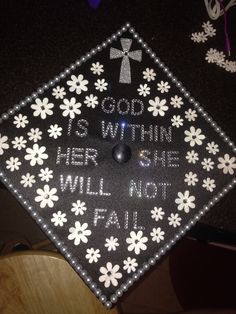 a black and white graduation cap that says, god is within her one will not fail