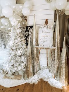 white and silver christmas decorations with balloons in the background