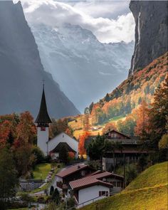 a church in the mountains surrounded by trees