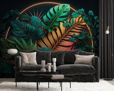 the living room is decorated with tropical plants and foliages, as well as a large wall mural