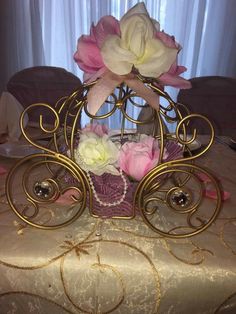 there is a small carriage with flowers in it