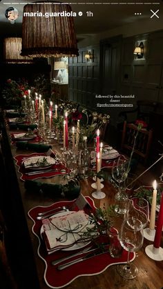 the table is set with candles and place settings