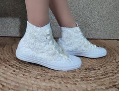 "There are many great benefits to wearing sneakers with your wedding dress - the most obvious is comfort. With a comfortable pair of tennis shoes on your feet, you will not have to avoid the track, you can easily do the laps at your reception and you will not wake up in the morning with unwanted blisters. The ivory lace with pearls in this dreamy couple is 100% worthy of a wedding. SIZE: Tip.. Its size Converse is smaller than other companies (eg. if you Nike wear 40, wear Converse 39) ★If you h Wedding High Top Converse, High Top Converse Wedding Shoes, White High-top Sneakers For Wedding, Bridal Converse Lace, White Low-top Bridal Sneakers, Custom White High-top Wedding Sneakers, Wedding Converse Sneakers & Athletic Shoes, Nike Wear, Converse High Top