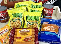 some snacks are sitting on a table with footballs and other items in the background