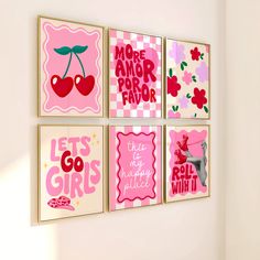 four pink and white wall art pieces hanging on the side of a wall in a room