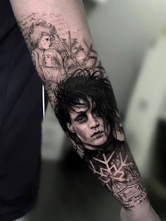 a man's arm with a tattoo on it and an image of a woman