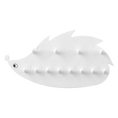 a white fish shaped object with holes in it