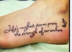 a foot with a tattoo saying life's roughest storms prove the strength of our anchors