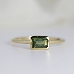 Yellow Gold Tourmaline Emerald-cut Ring, Green Sapphire Ring With Emerald Cut Bezel Setting, Green Emerald-cut Sapphire Ring With Bezel Setting, Minimalist 14k Gold Emerald Cut Sapphire Ring, Minimalist Yellow Gold Sapphire Ring With Emerald Cut, Senior Rings, Green Engagement Rings, Emerald Cut Sapphire Ring, Gold Ring Band