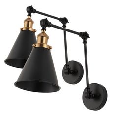 two black and gold wall lights hanging from the ceiling, with one light on each side