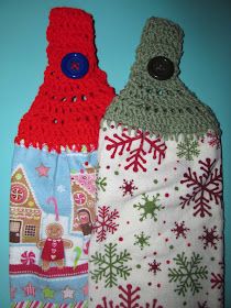 two crocheted christmas stocking hangers on a blue wall