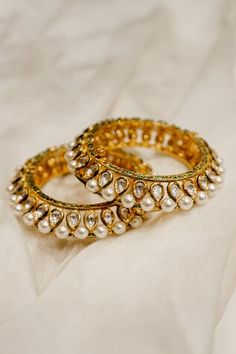 22k gold plated bangles with clear stone studded drop motifs, white pearl detail and green enamel detail. - Aza Fashions Jewellery Bangles Gold, Jewellery Bangles, Bangles Gold, Pearl Bangle, Gold Plated Bangles, Stone Studs, Clear Stone, Bangle Set, Green Enamel