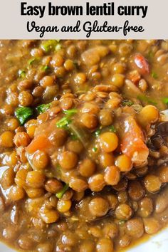 a white plate topped with beans and broccoli covered in brown lentil curry