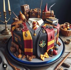 a harry potter themed cake with hogwart's houses and other things on it