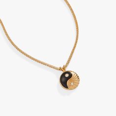 Just as day turns to night, dark and light hold in eternal balance, maintaining a sacred symmetry. This Black Onyx Yin Yang necklace, in 14kt gold plate, is a wearable symbol of that divine balance. The yin yang charm, one half black onyx and one half textured gold plate, has sparkling cubic zirconia accents on both sides. On the back, the charm says “strength and intuition,” as a reminder that it all comes from within. This necklace is adjustable between 18” and 20”. Chain length: 20", adjusts Ying Yang Jewelry, Yin Yang Jewelry, Yin Yang Charm, Yin Yang Necklace, One Half, Cross Bracelet, Charm Bangle, Adjustable Necklace, Charm Gift