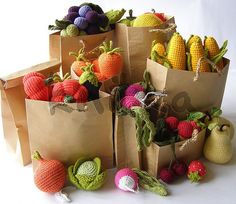 a pile of bags filled with different types of fruits and vegetables