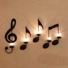 musical notes are mounted to the wall with lights