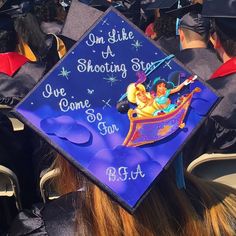 a graduation cap that says on like a shooting star, we come to the top