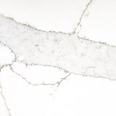 a white marble floor with cracks in it