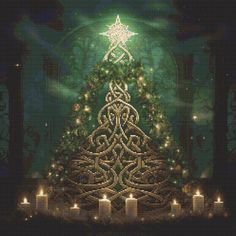 a cross stitch christmas tree with candles