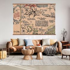 a living room filled with furniture and a large map hanging on the wall above it