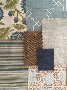 several different colors and patterns of fabric on a tablecloth or wallpapers, including blue, green, brown, beige and white