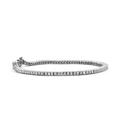 This princess cut tennis bracelet has 2 carats of princess cut diamonds set in 14k white gold .  The diamonds are set with 4 prongs, not the traditional bar set. This bracelet shines, glitters. Princess cut diamonds are G-H Color SI clarity. 7 long.  Can be made in additional lengths. Contact us. Traditional Bar, Bar Set, Princess Cut Diamonds, 2 Carat, Tennis Bracelet, Princess Cut, Apparel Accessories, Diamond Cuts, Silver Bracelet