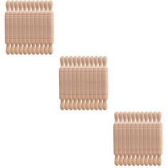 three pieces of hair combs sitting next to each other