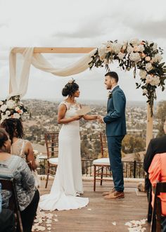 a bride and groom standing at the end of their wedding ceremony