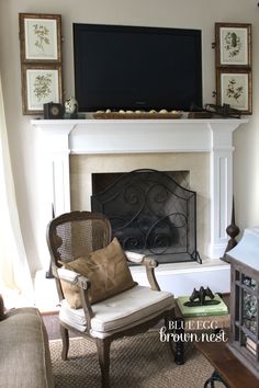 a living room filled with furniture and a flat screen tv mounted above a fire place