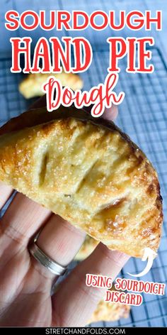 a hand holding a piece of bread with the words sourdough hand pie dough on it