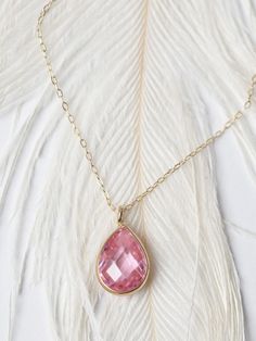 "Get Extra 5% off when you put your item in their cart! CODE: \"MOTHERDAYDEALS\" Pink Sapphire Teardrop Necklace/ Pear Shaped Pink Zircon Pendant/ Faceted Pink Sapphire Necklace/ Everyday Necklace/ Birthday Gift This beautiful, classic solitaire 10 x6mm pear shaped stone is the epitome of understated elegance. The wearer of this exquisite piece is sure to be the envy of everyone in the room with this sparkling pendant that can be worn everyday. Features * Made to Order *Gold KT: 14K Solid Gold * Elegant Pendant Crystal Necklace For Gift, Exquisite Pink Necklace For Gift, Elegant Pink Necklace As A Gift, Elegant Pink Necklace As Gift, Gold Briolette Birthstone Necklace, Gold Briolette Birthstone Necklace Fine Jewelry, Elegant 14k Gold Birthstone Necklace With Briolette Shape, Gold Briolette Birthstone Necklace In Fine Jewelry Style, Teardrop Birthstone Necklace In Fine Jewelry