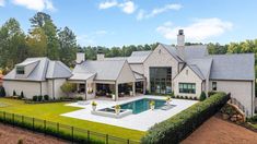 a large house with a pool in the yard