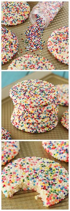 sprinkle covered cookies sitting on top of a cookie sheet