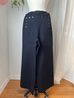 "1950s U.S. Navy Sailor Pants Features: These pants were my grandfather's original navy uniform pants. He was a third-class boatmen's mate and served from 1952-1955. He spent time oversees in Hawaii, Philippines, Guam, Formosa (now Taiwan), Hong Kong and Japan. He Served on the USS Onslow that was a sea plane tender. Has all original 13 buttons, pocket zipper works, beautiful condition a few minor imperfections, read description below and see photos. *Measurements:  -Waist: 30\" (total circumfer Navy Workwear Bottoms With Buttons, Navy Buttoned Bottoms For Work, Navy Bottoms With Buttons For Work, Vintage Full-length Bottoms With Buttons, Vintage Full Length Bottoms With Buttons, Vintage High Waist Pants With Buttons, Vintage High-waist Pants With Buttons, Vintage High-waisted Pants With Button Closure, Navy Uniform