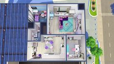 an aerial view of a house with the bedroom and living room in blue, white and pink