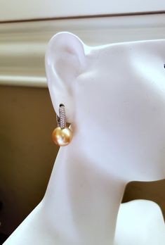 High quality perfect round saltwater cultured Southsea pearl post earrings, rare to find natural medium-deep gold color, untreated, non-dyed *Made with top quality AAA grade almost flawless cultured Southsea pearls and solid 18Kt white gold with cubic zirconia. Safe for sensitive skin. * 11.3mm pearls. *Leverback closure. * Other pearl size available, message me for a quote *All my pieces are safely packed in a gift presentation box. See other design in my store: http://www.etsy.com/shop/JWJewel Hypoallergenic Round Pearl Earrings For Formal Occasions, Round Pierced Pearl Earrings For Formal Occasions, Pierced Round Pearl Earrings For Formal Occasions, Round Pierced Pearl Earrings For Anniversary, Round High Luster Pearl Earrings For Formal Occasions, Anniversary Pearl Earrings Pierced, High Luster Pearl Earrings For Formal Occasions, Formal High Luster Round Pearl Earrings, Pearl Clip-on Earrings