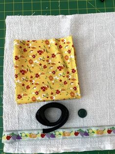 sewing supplies laid out on top of a piece of cloth