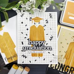 congratulations card with graduation cap and gown on it, surrounded by other greeting cards that say happy graduation